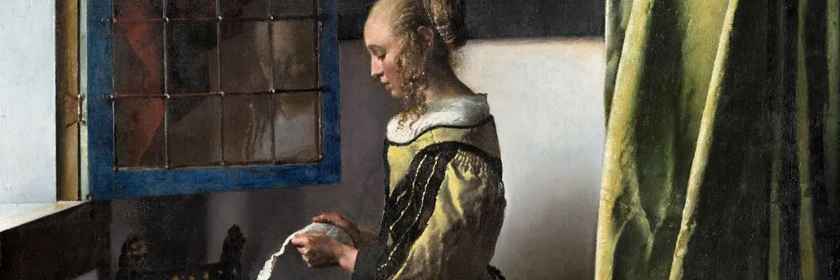 Girl standing at the window reading a letter